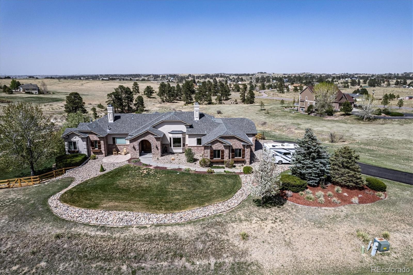 12080 Summit Ridge Road Parker, CO 80138 - Photo 3 of 39 an aerial view of a house with outdoor space