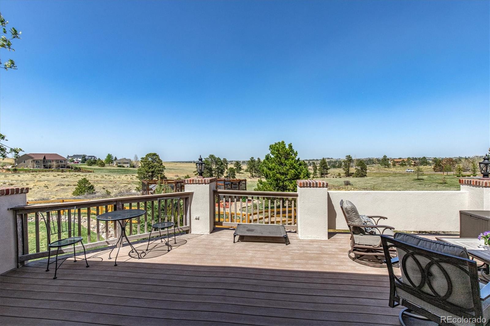 12080 Summit Ridge Road Parker, CO 80138 - Photo 34 of 39 a view of a terrace with seating space