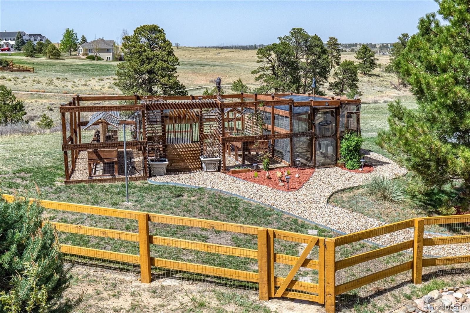 12080 Summit Ridge Road Parker, CO 80138 - Photo 35 of 39 a view of a house with a yard