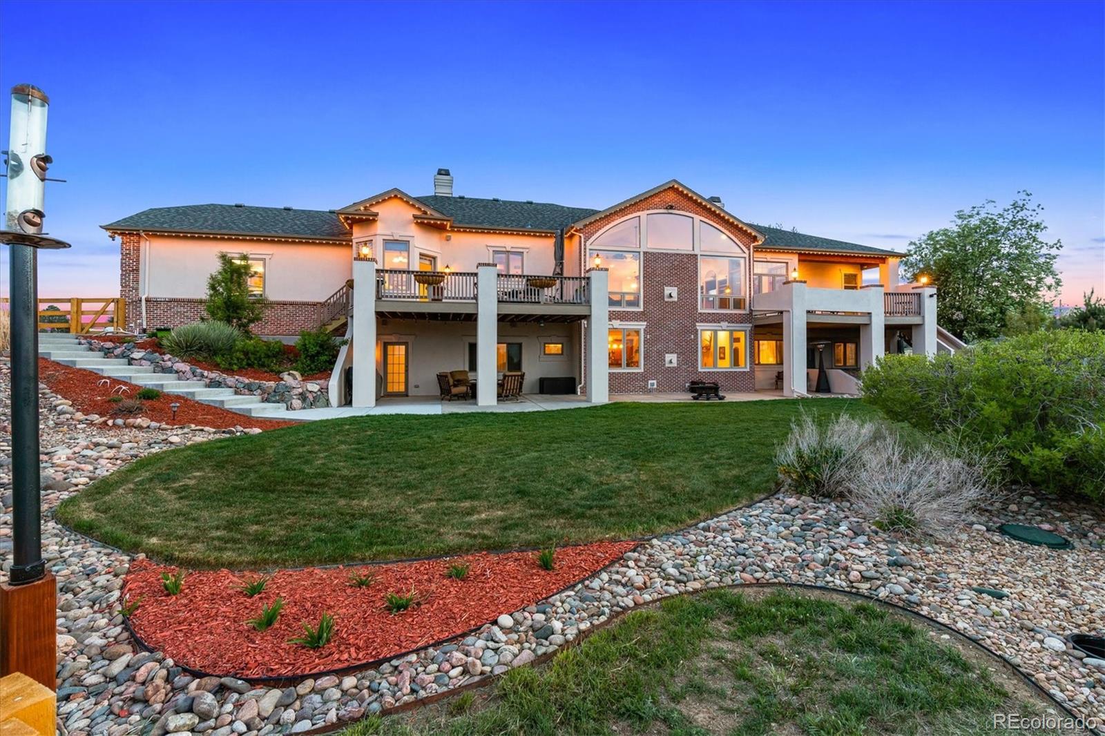 12080 Summit Ridge Road Parker, CO 80138 - Photo 36 of 39 a front view of a house with a yard