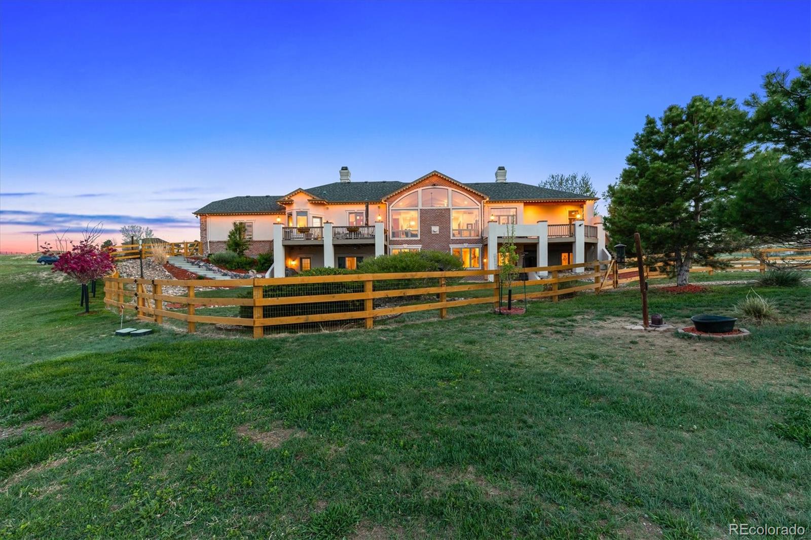 12080 Summit Ridge Road Parker, CO 80138 - Photo 37 of 39 a view of a house with a yard