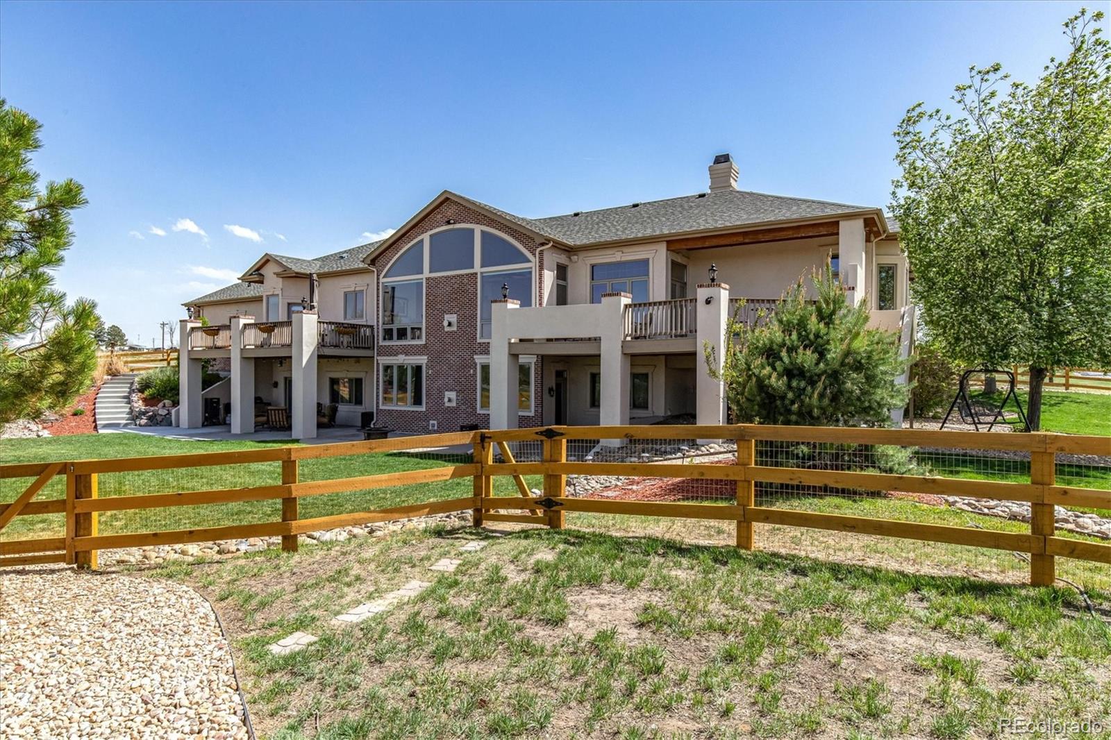 12080 Summit Ridge Road Parker, CO 80138 - Photo 39 of 39 a front view of a house with a yard