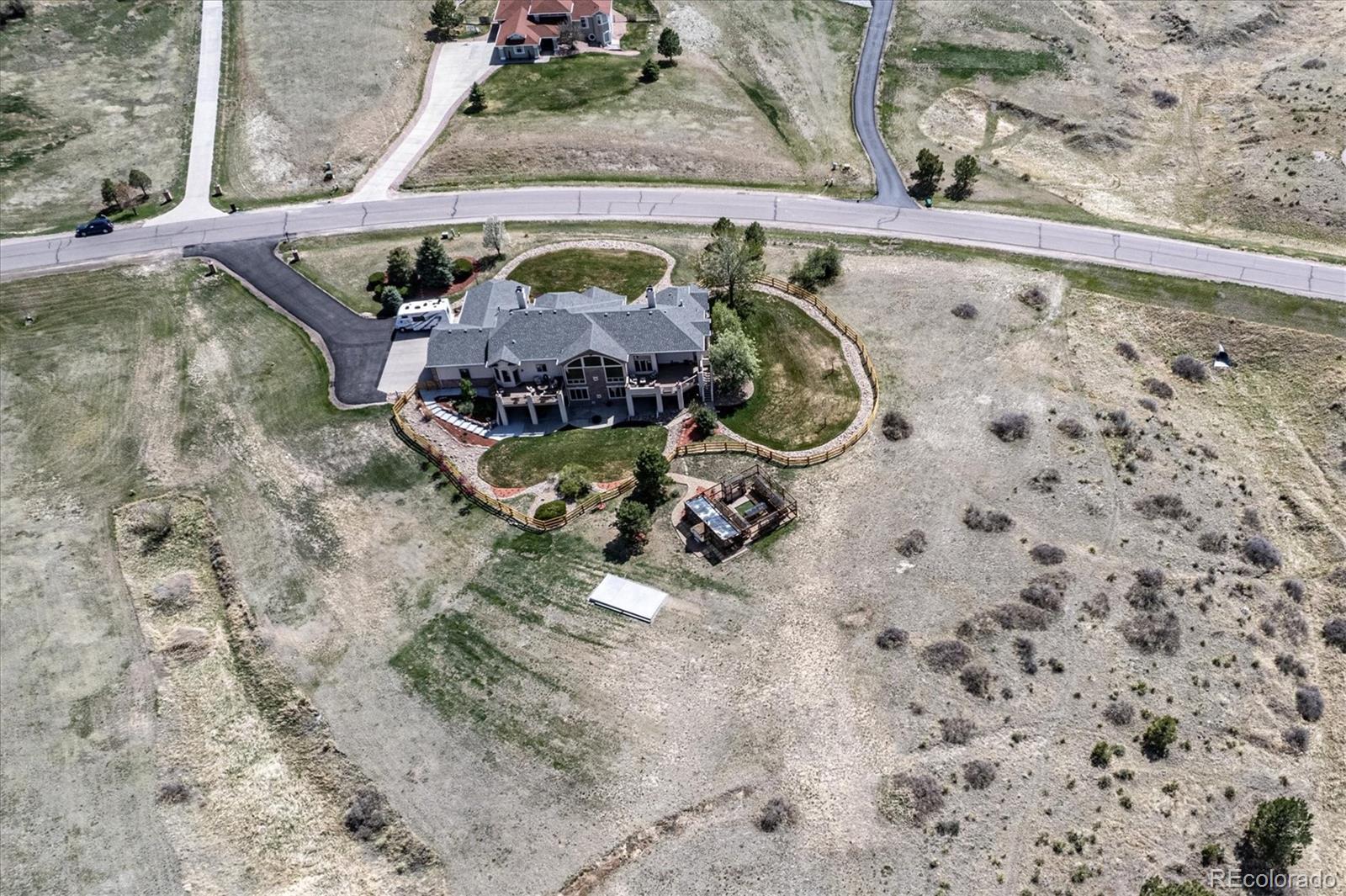 12080 Summit Ridge Road Parker, CO 80138 - Photo 5 of 39 a room with water heater and wooden floor