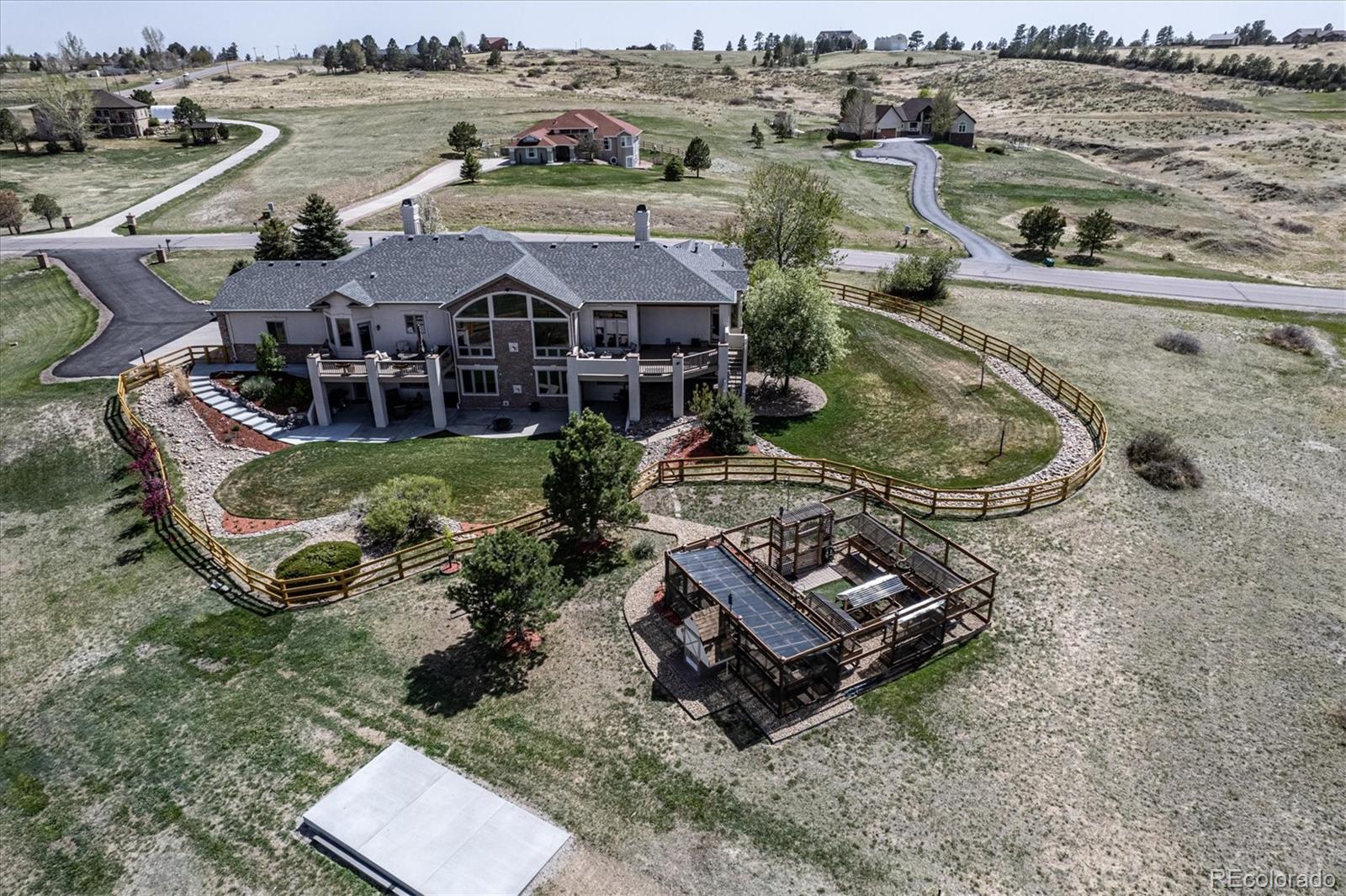 12080 Summit Ridge Road Parker, CO 80138 - Photo 6 of 39 an aerial view of a house with outdoor space