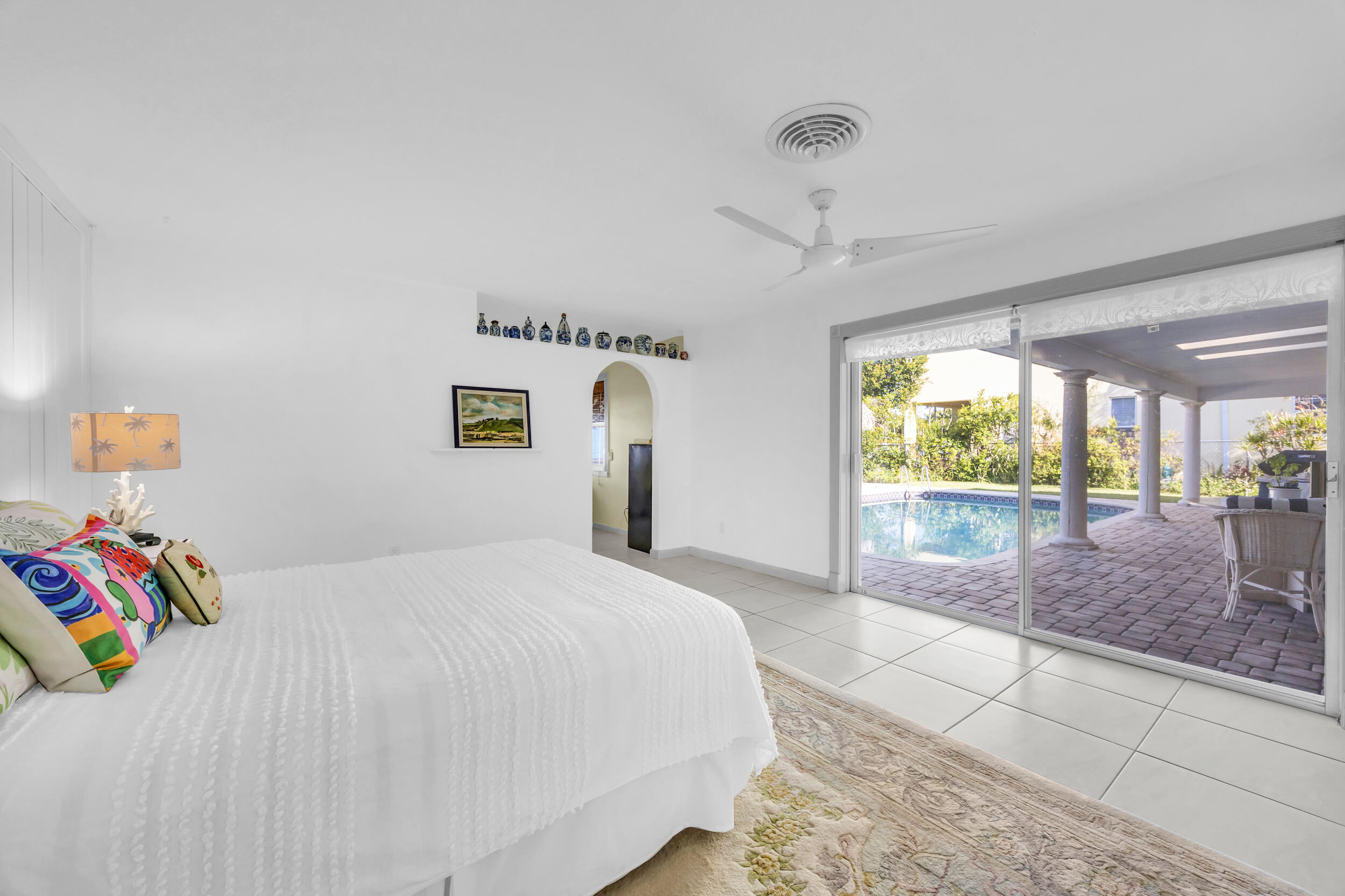 910 Dolphin Drive Jupiter, FL 33458 - Photo 13 of 29 Primary bedroom with pool view