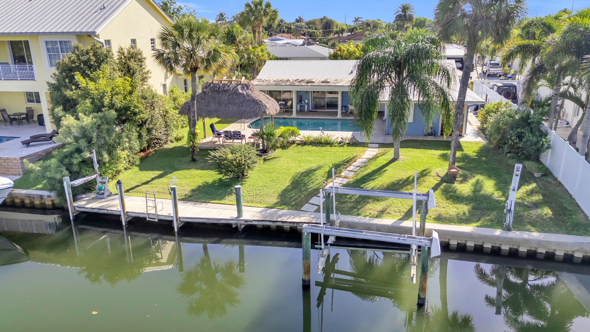 910 Dolphin Drive Jupiter, FL 33458 - Photo 2 of 29 Boat lift and dock in place