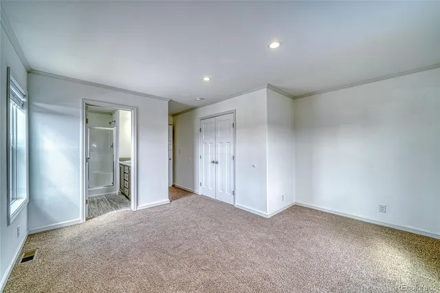 a bathroom with a granite countertop sink a mirror and a shower