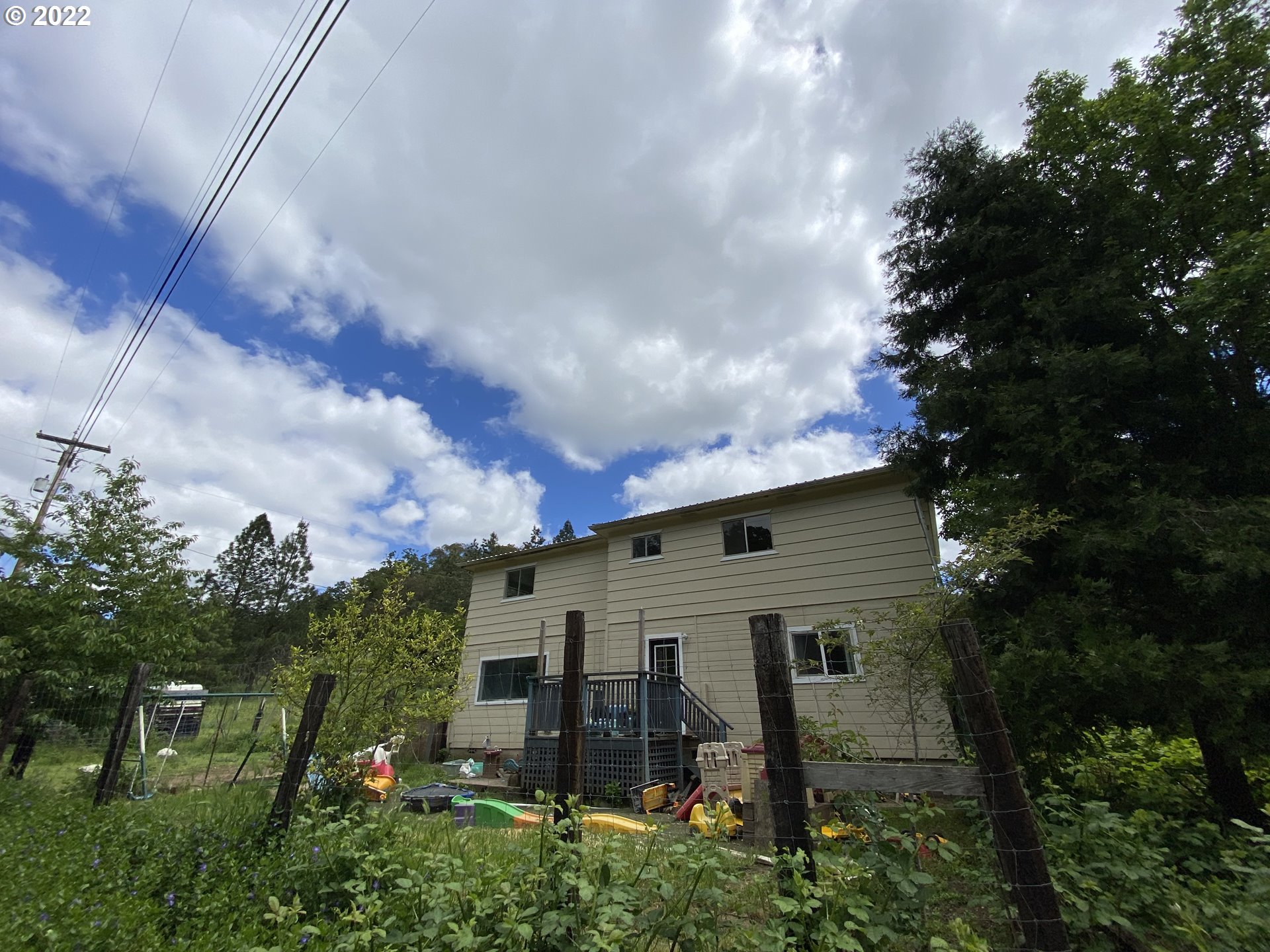 3005 Shoestring Road Riddle, OR 97469 - Photo 26 of 32 a front view of a house with garden