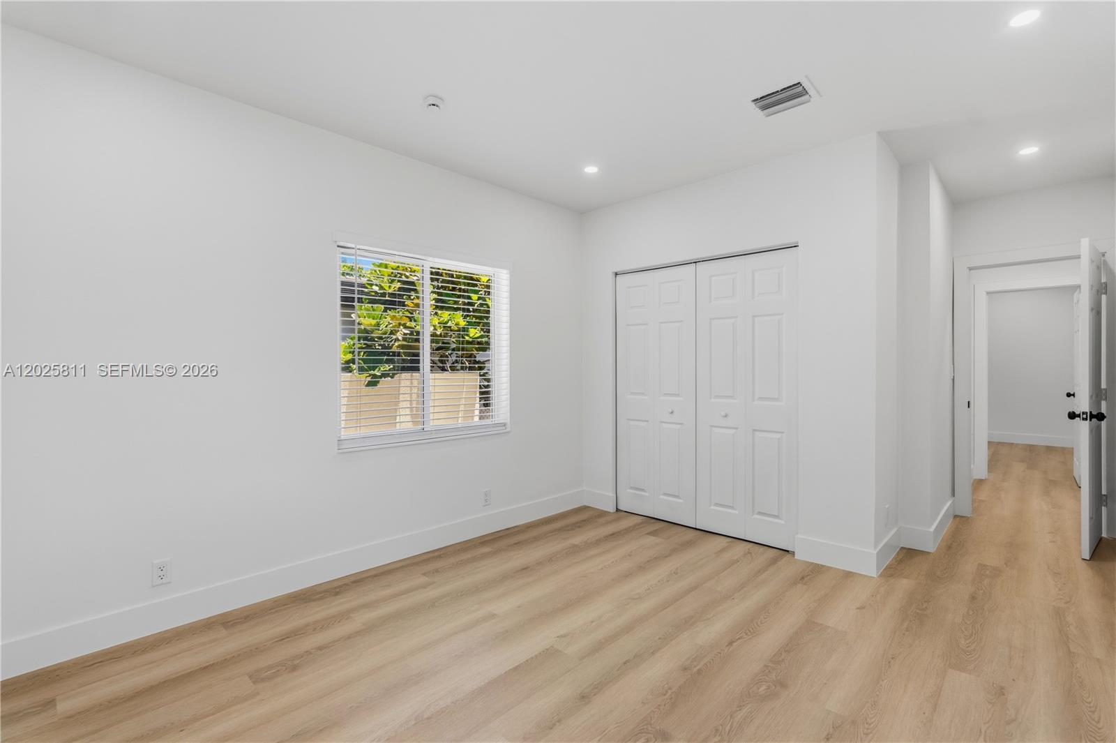 2110 Southwest 15th Street Miami, FL 33145 - Photo 21 of 37 wooden floor in an empty room with a window