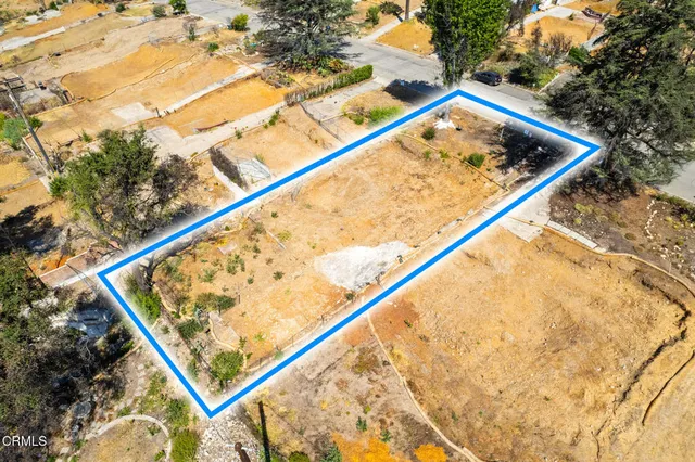 a wooden street with a snow in the background