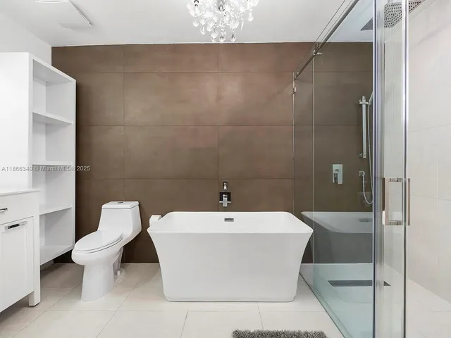 a white bath tub sitting in a bathroom