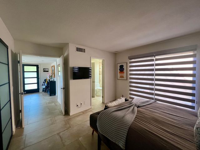 a view of a chairs and table in the patio
