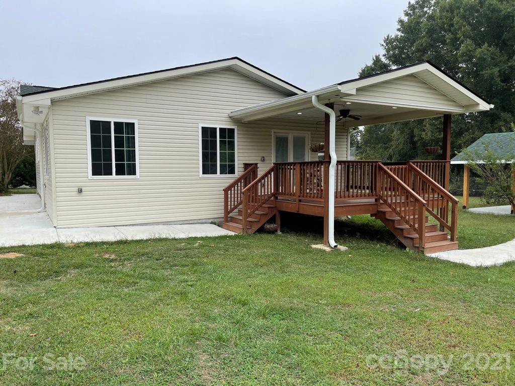 1803 Sim Williams Road Monroe, NC 28112 - Photo 3 of 12 a view of a house with backyard