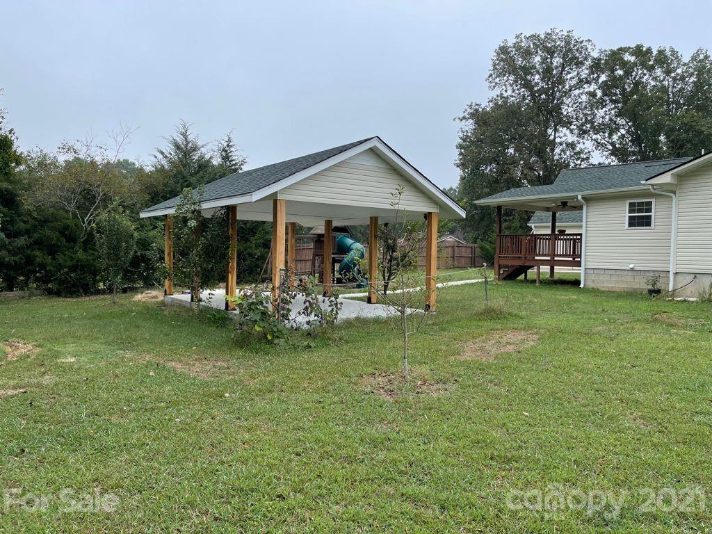 1803 Sim Williams Road Monroe, NC 28112 - Photo 4 of 12 a view of a house with a yard and sitting area