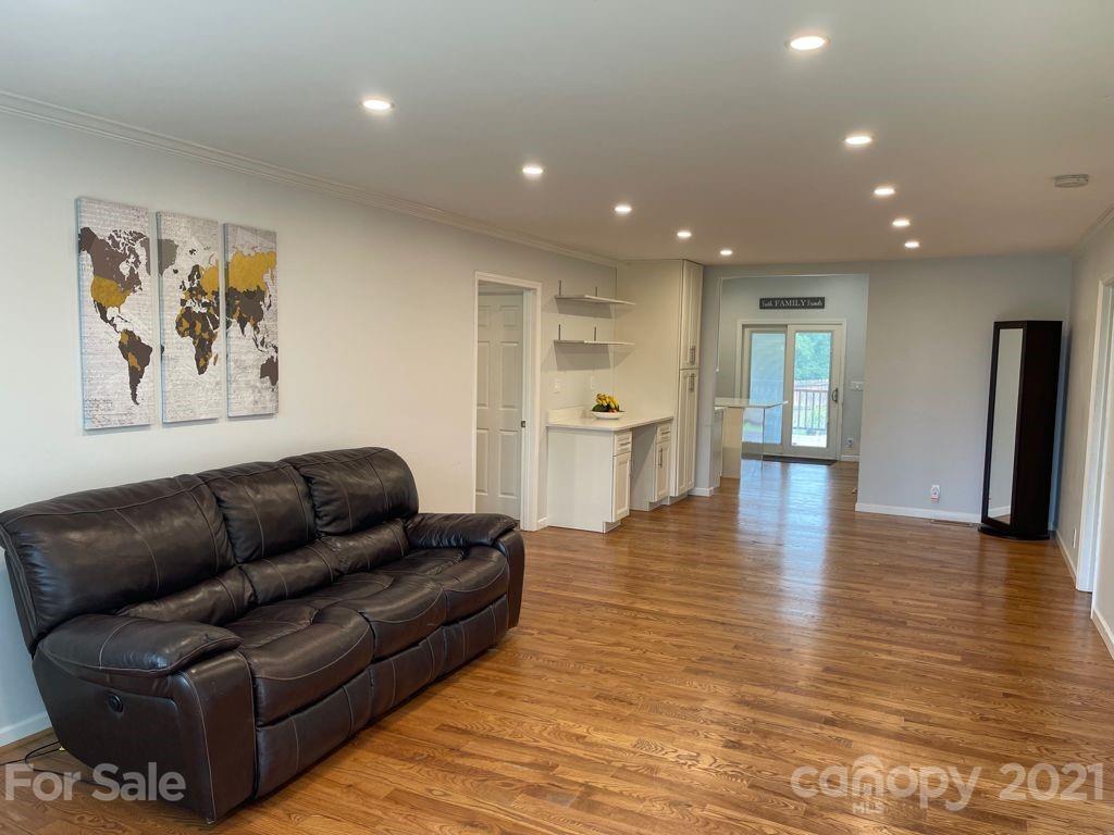 1803 Sim Williams Road Monroe, NC 28112 - Photo 5 of 12 a living room with furniture and wooden floor