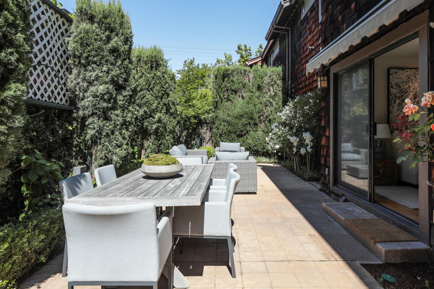 1145 Pine Street Menlo Park, CA 94025 - Photo 18 of 25 a view of a patio with table and chairs and potted plants