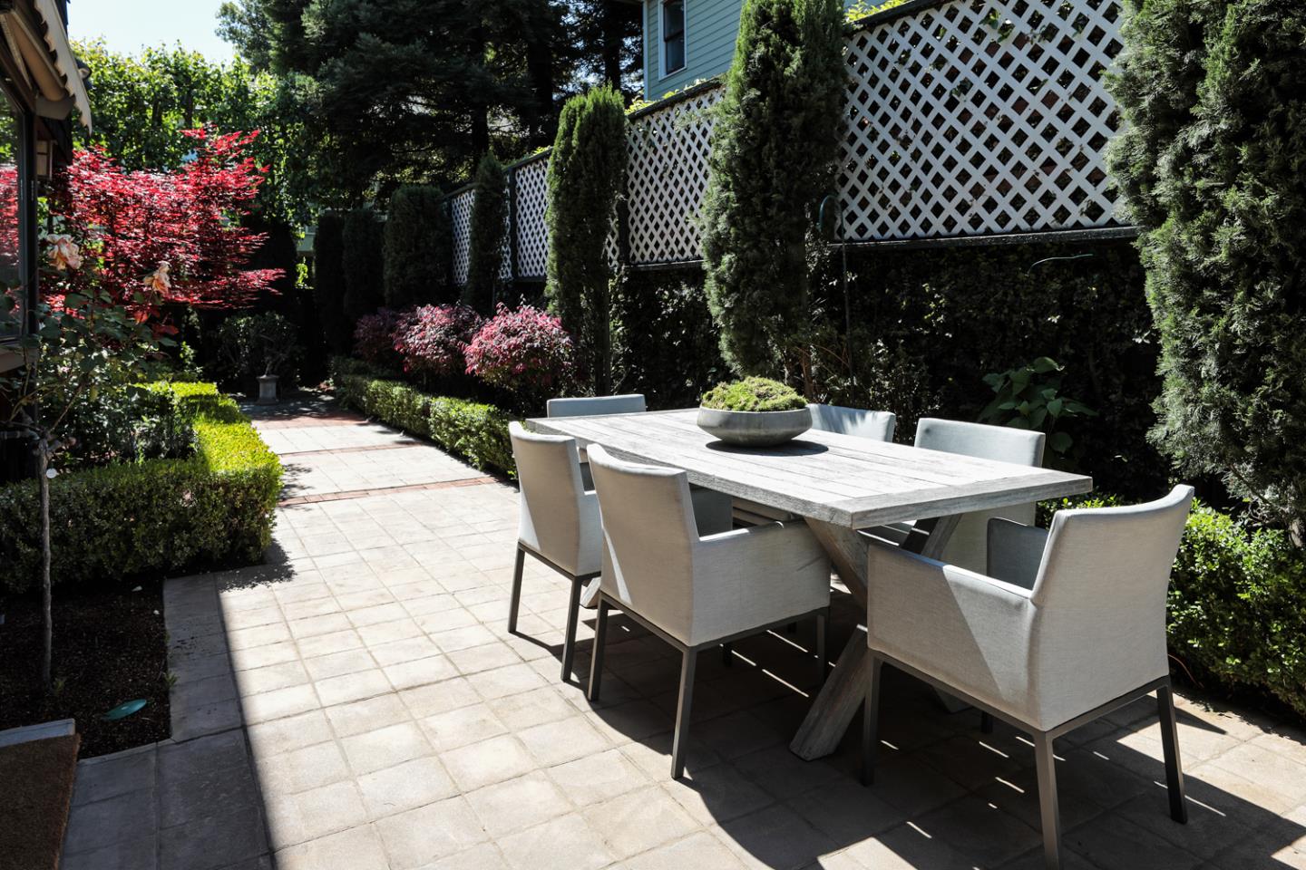 1145 Pine Street Menlo Park, CA 94025 - Photo 19 of 25 a view of a patio with table and chairs and potted plants