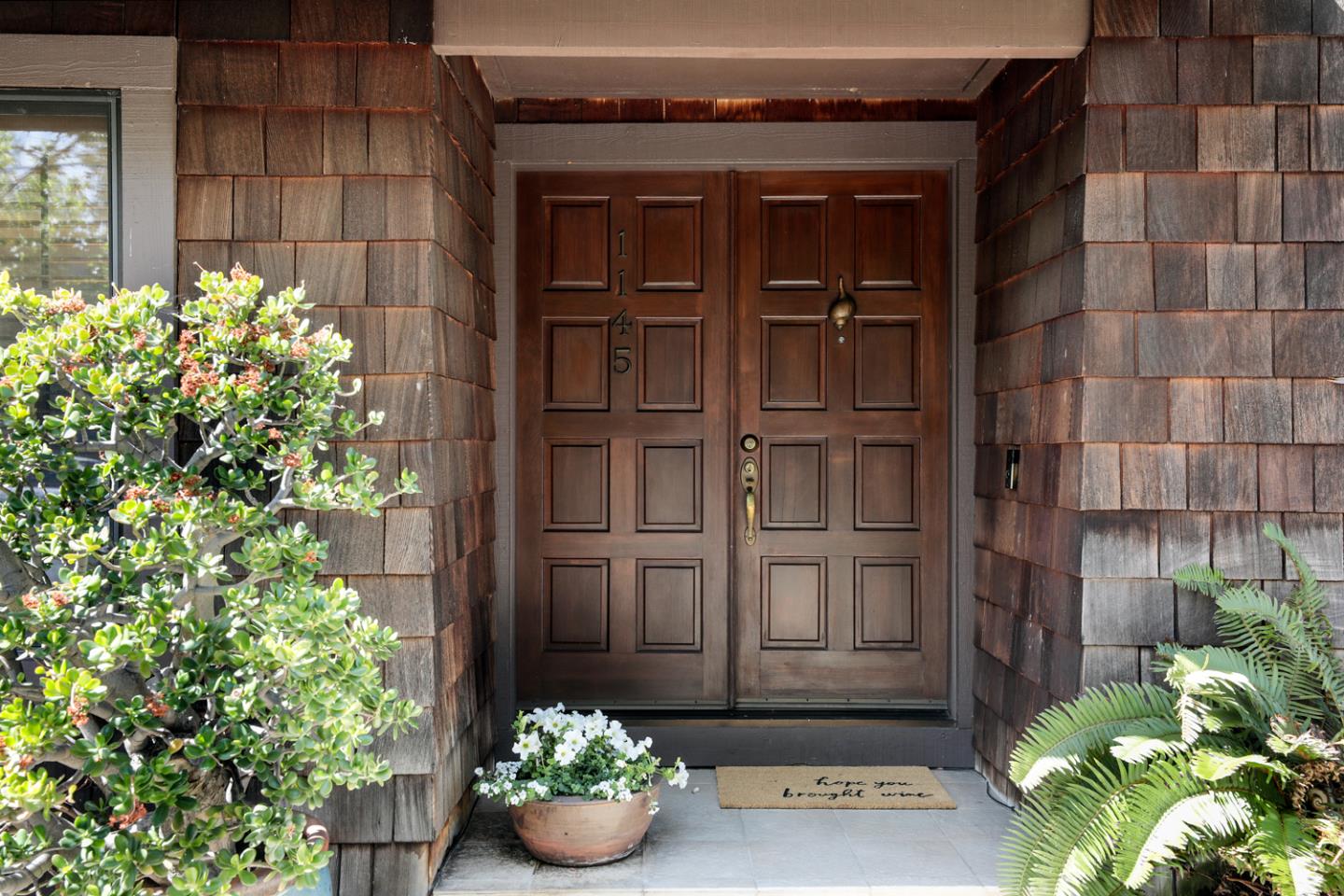 1145 Pine Street Menlo Park, CA 94025 - Photo 2 of 25 a view of a potted plant in front of a door