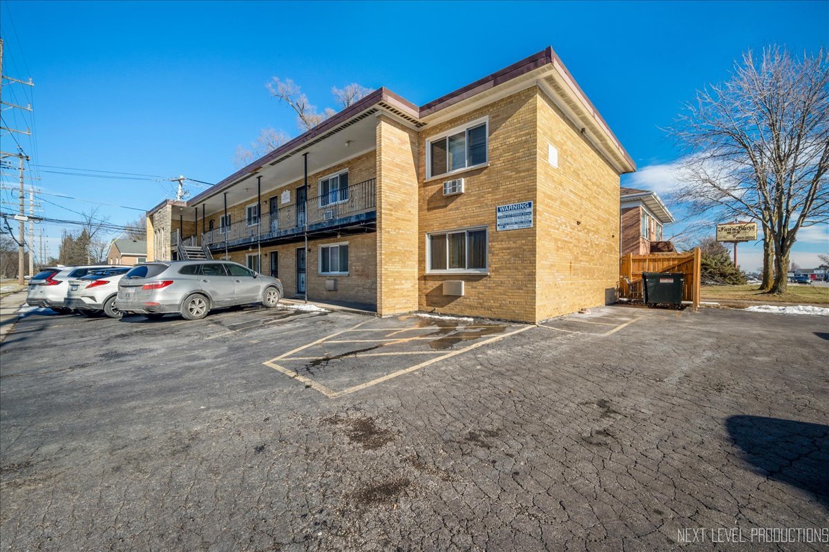 627 South Blanchard Street, Unit B3 Wheaton, IL 60187 - Photo 1 of 8 a cars parked in front of a house