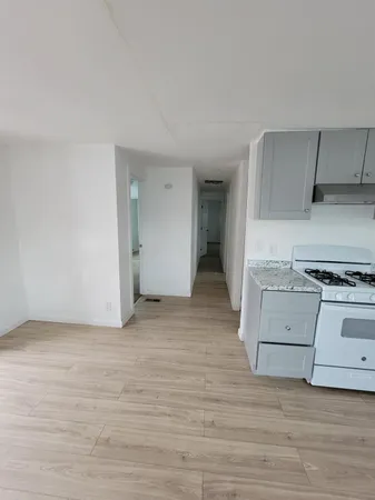 a view of kitchen and wooden floor