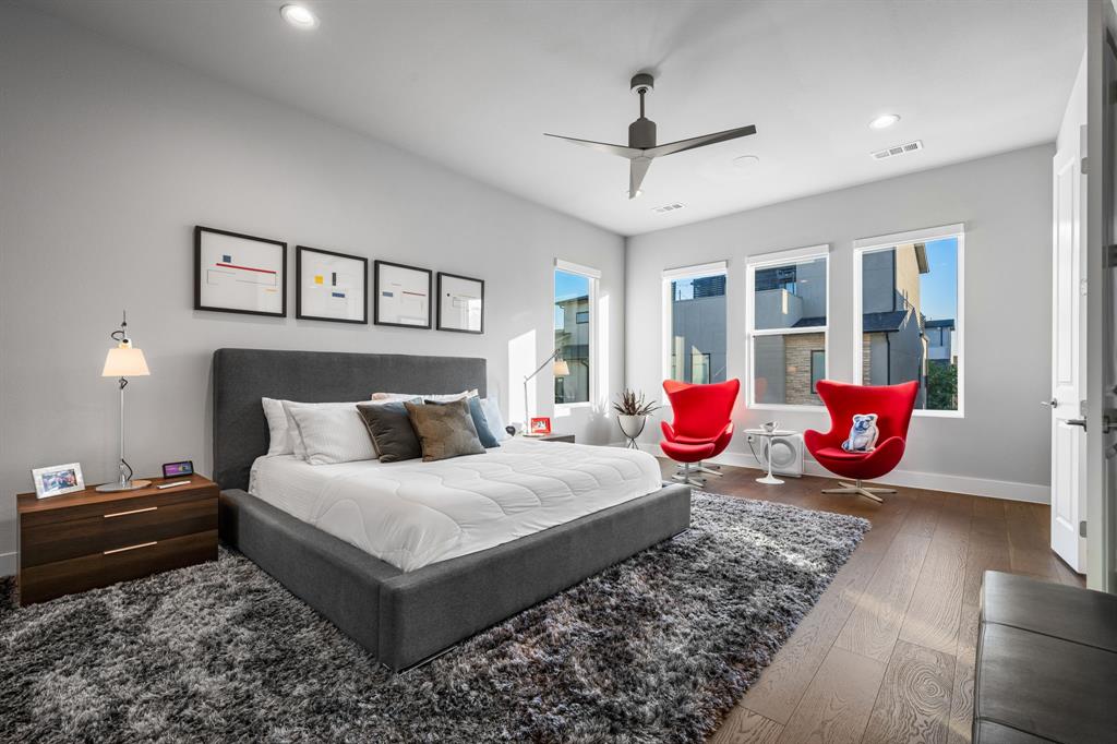 4138 Entrada Way Dallas, TX 75219 - Photo 17 of 40 a bedroom with bed and wooden floor