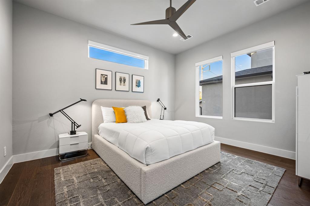 4138 Entrada Way Dallas, TX 75219 - Photo 23 of 40 a bedroom with a bed and a window