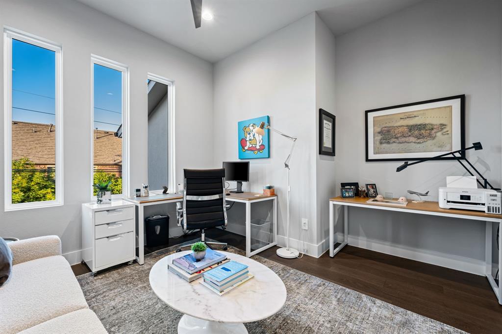 4138 Entrada Way Dallas, TX 75219 - Photo 28 of 40 a view of a workspace with furniture and a kitchen