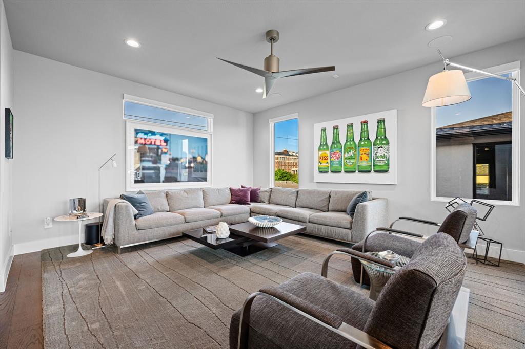 4138 Entrada Way Dallas, TX 75219 - Photo 31 of 40 a living room with furniture and a large window
