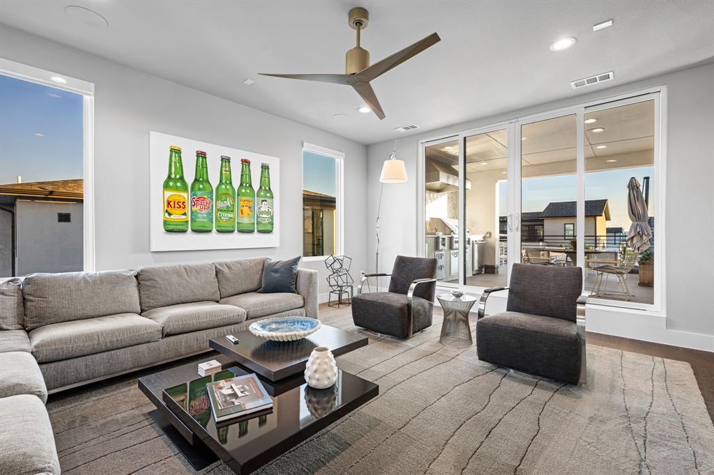 4138 Entrada Way Dallas, TX 75219 - Photo 33 of 40 a living room with furniture and a large window