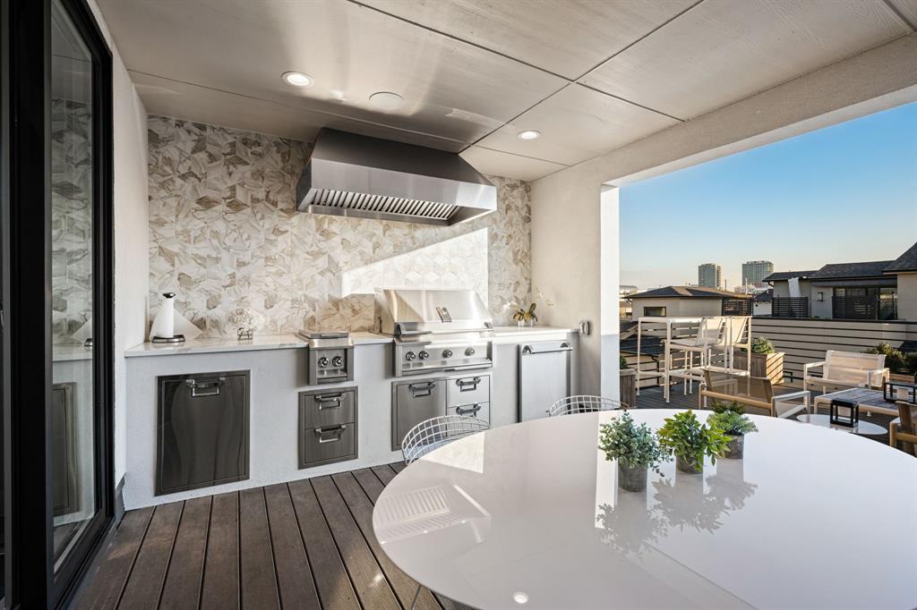 4138 Entrada Way Dallas, TX 75219 - Photo 34 of 40 a kitchen with a table and chairs