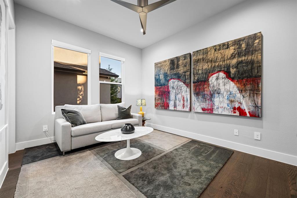 4138 Entrada Way Dallas, TX 75219 - Photo 37 of 40 a living room with furniture and a painting on the wall