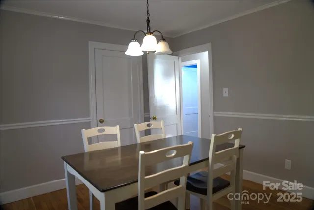 a dining room with a table and chairs