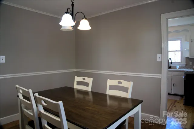a view of kitchen and dining room with wooden floor