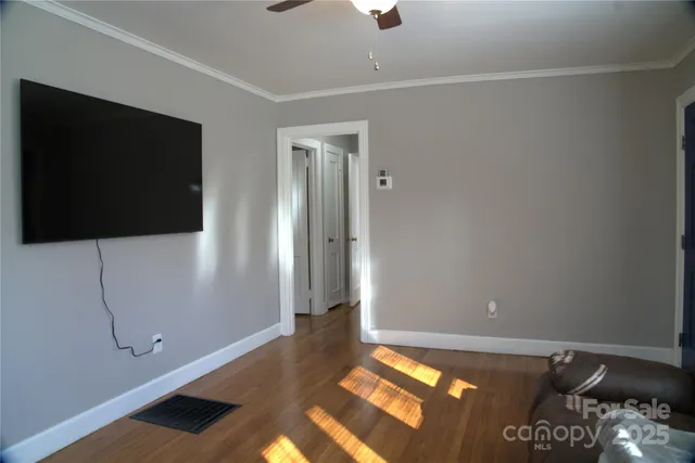 a view of an empty room with a flat screen tv