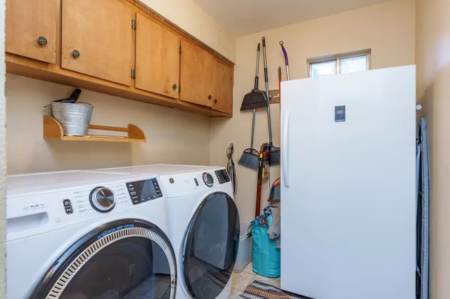 a bedroom with bed and wooden floor