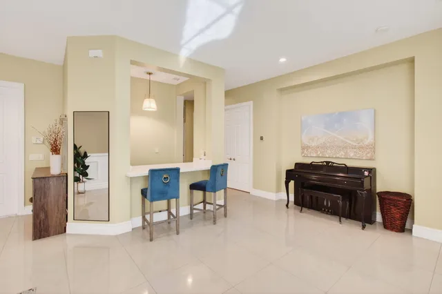 a view of a big yard with plants and large trees