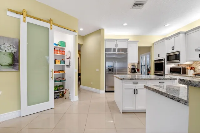 a living room with fireplace furniture and a flat screen tv