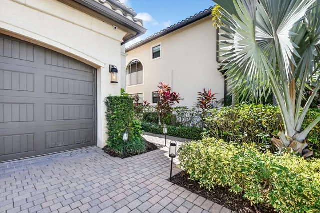 a living room with furniture a large window and a flat screen tv