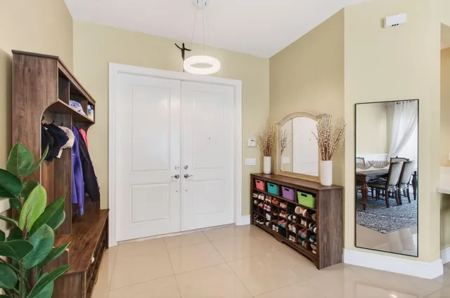 a spacious bedroom with a bed and a dresser in it