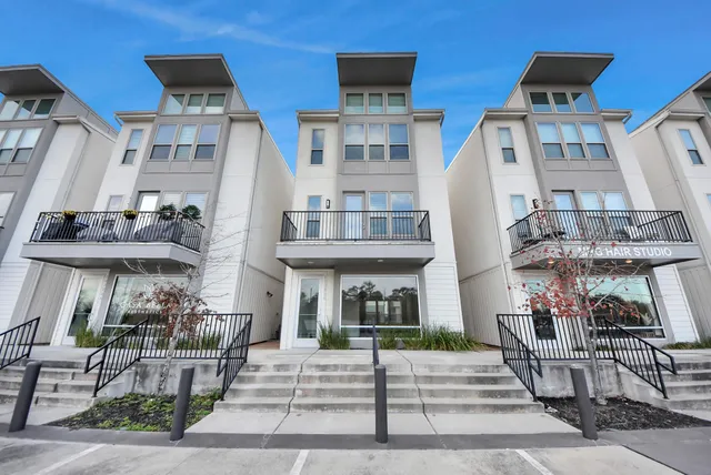 a view of wooden floor and windows in a room