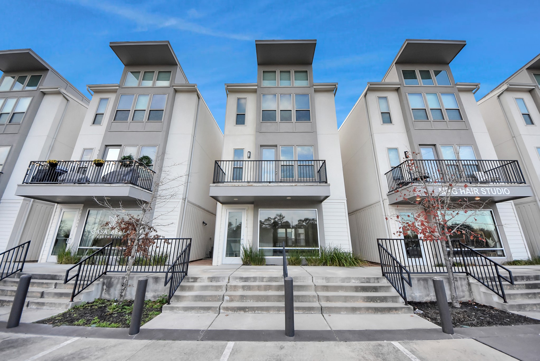 Contemporary Centro live/work townhome featuring modern architecture and clean-lined design within a thoughtfully planned community. Digitally Enhanced.