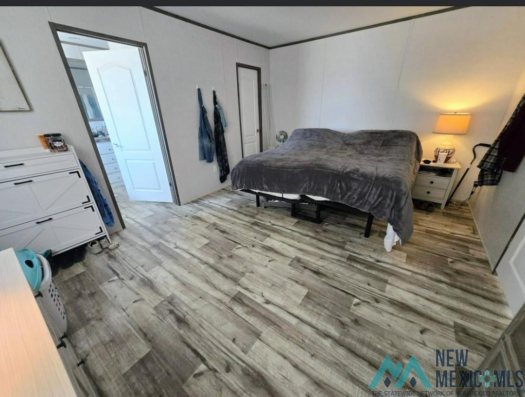 14006 Ciguena Road Southwest Deming, NM 88030 - Photo 10 of 49 Wood-finish flooring throughout