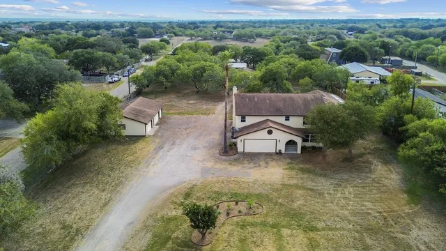 an aerial view of a houses with outdoor space