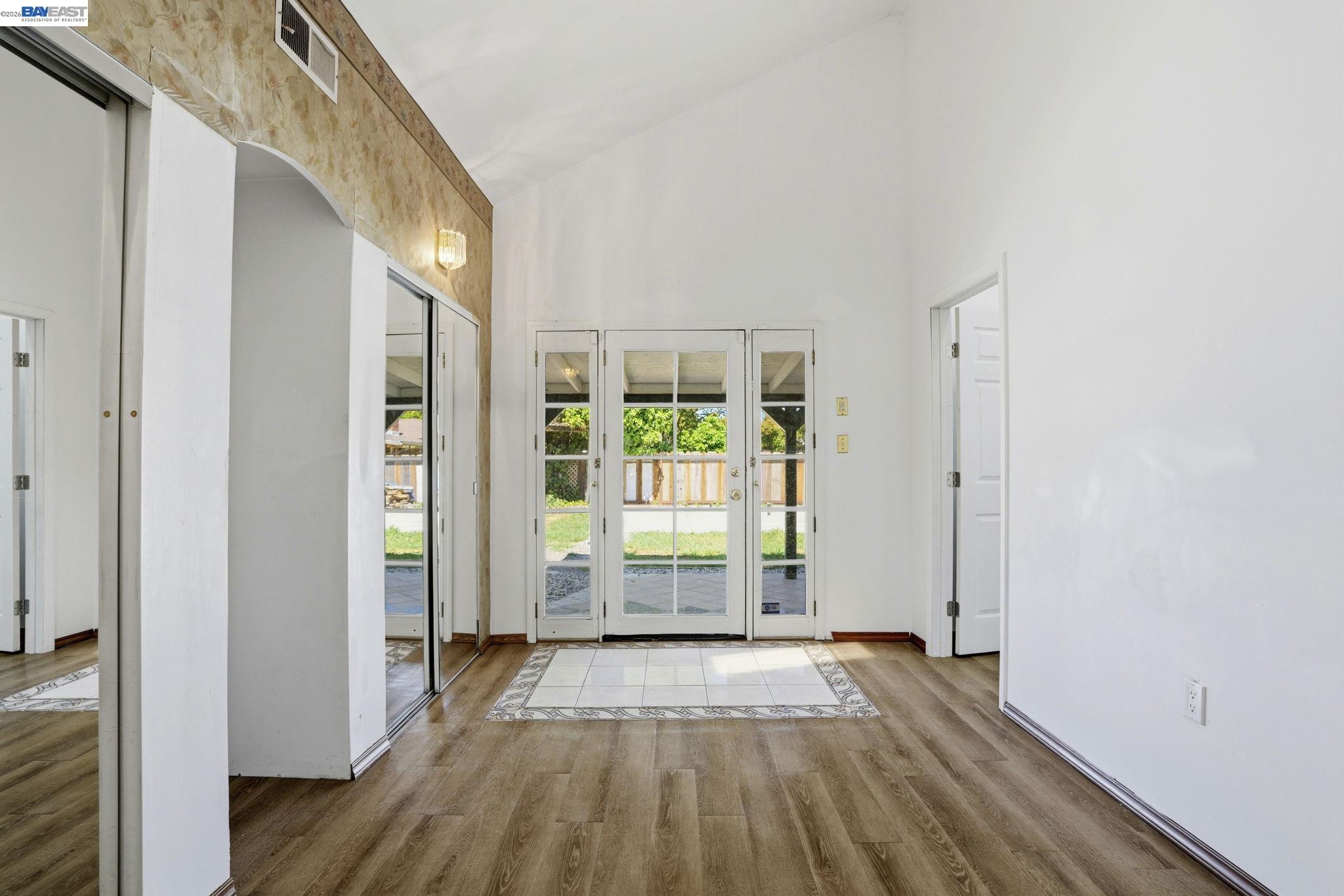 315 M Street Patterson, CA 95363 - Photo 11 of 17 a view of a room with wooden floor and windows