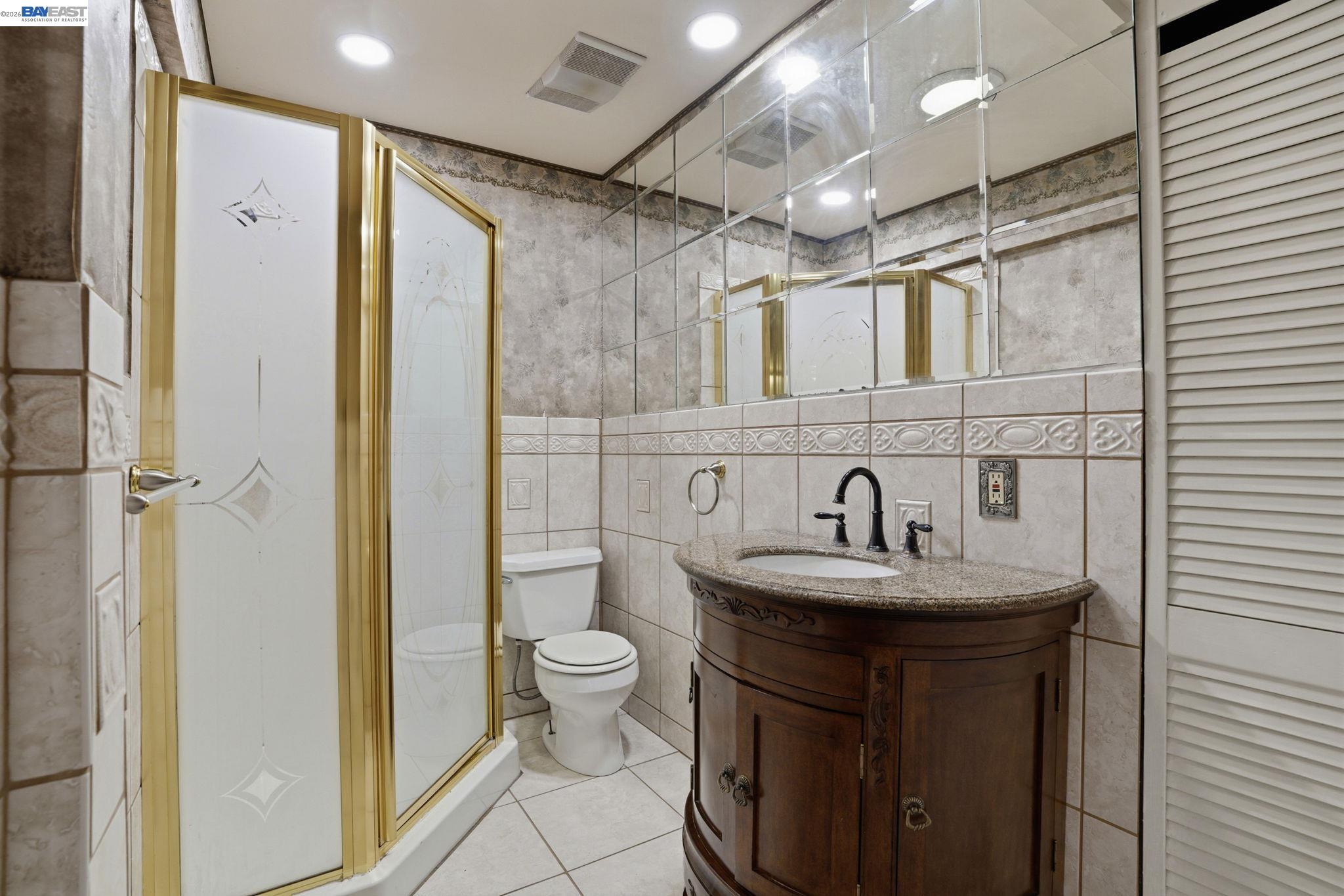 315 M Street Patterson, CA 95363 - Photo 12 of 17 a bathroom with a sink toilet and shower