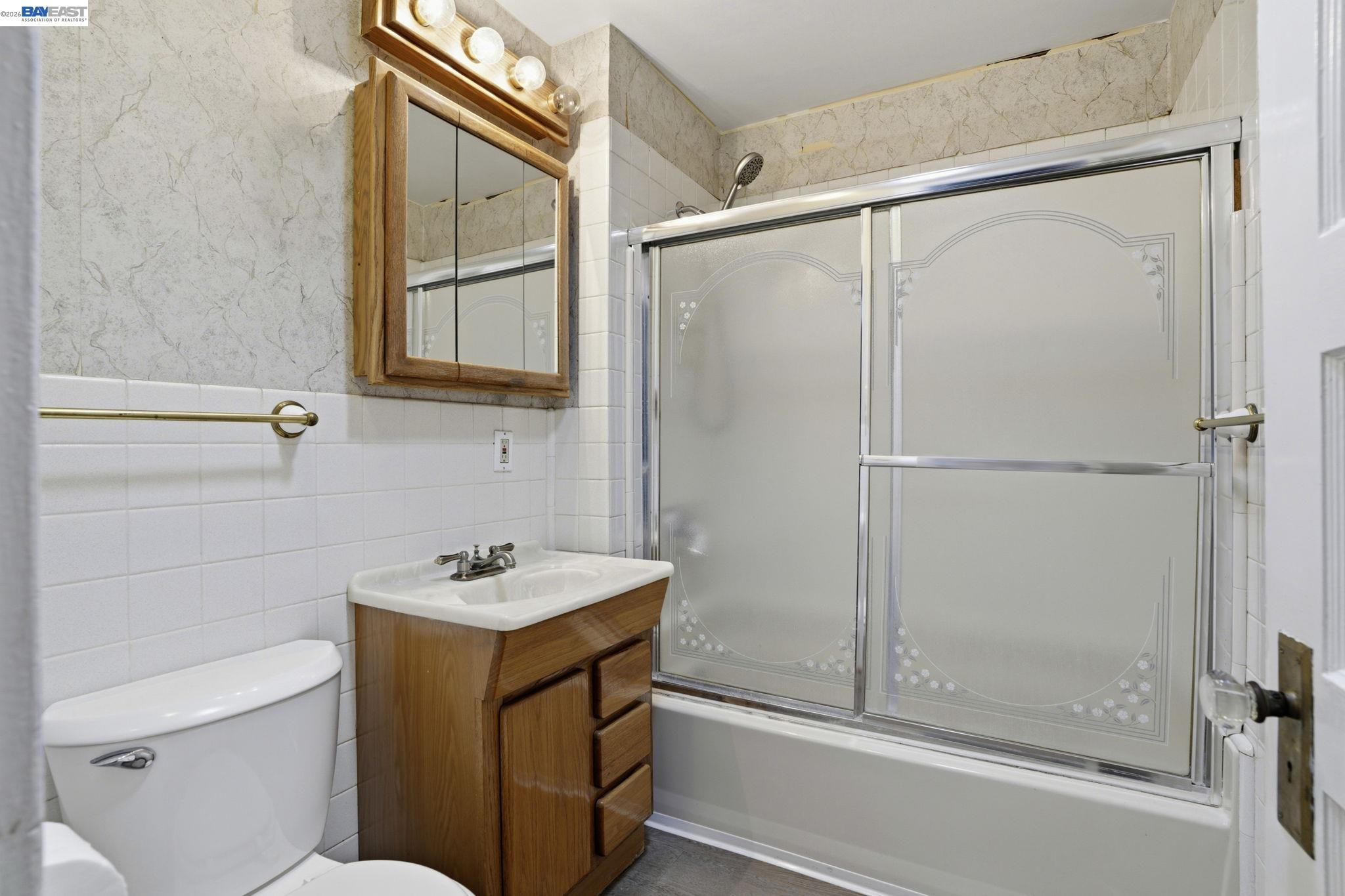 315 M Street Patterson, CA 95363 - Photo 13 of 17 a bathroom with a sink a toilet and shower