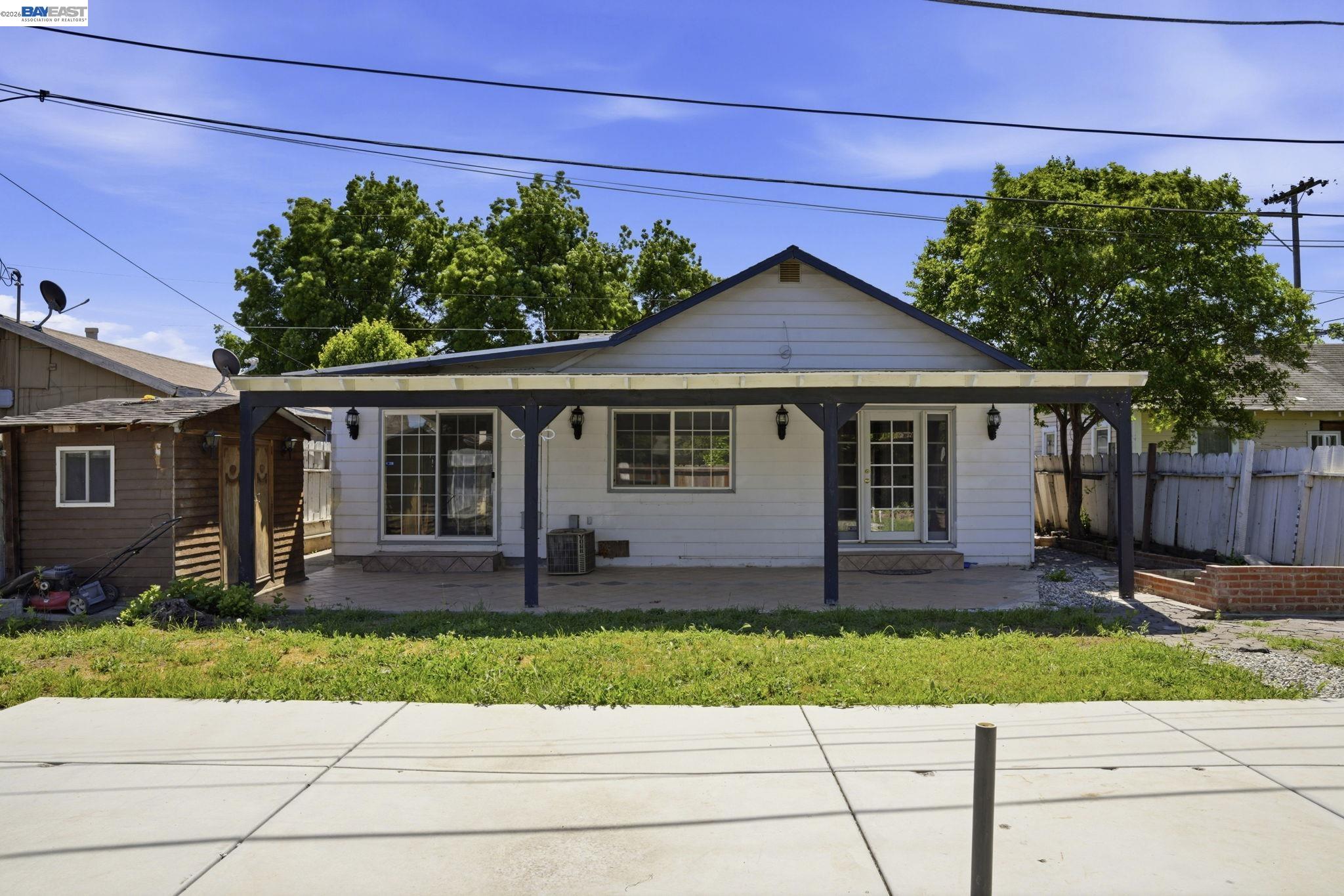315 M Street Patterson, CA 95363 - Photo 17 of 17 front view of a house and a yard