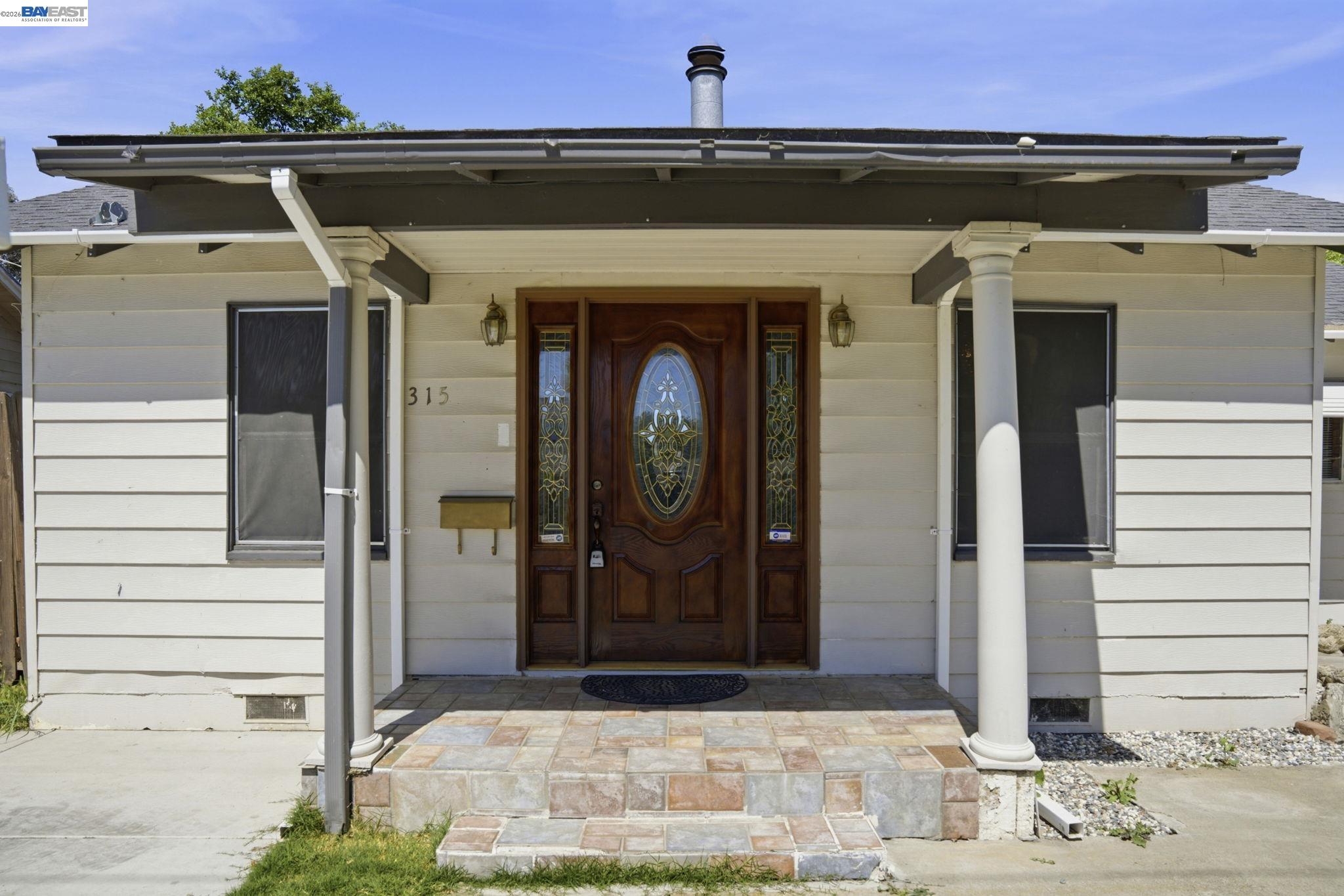 315 M Street Patterson, CA 95363 - Photo 2 of 17 a front view of a house with shower