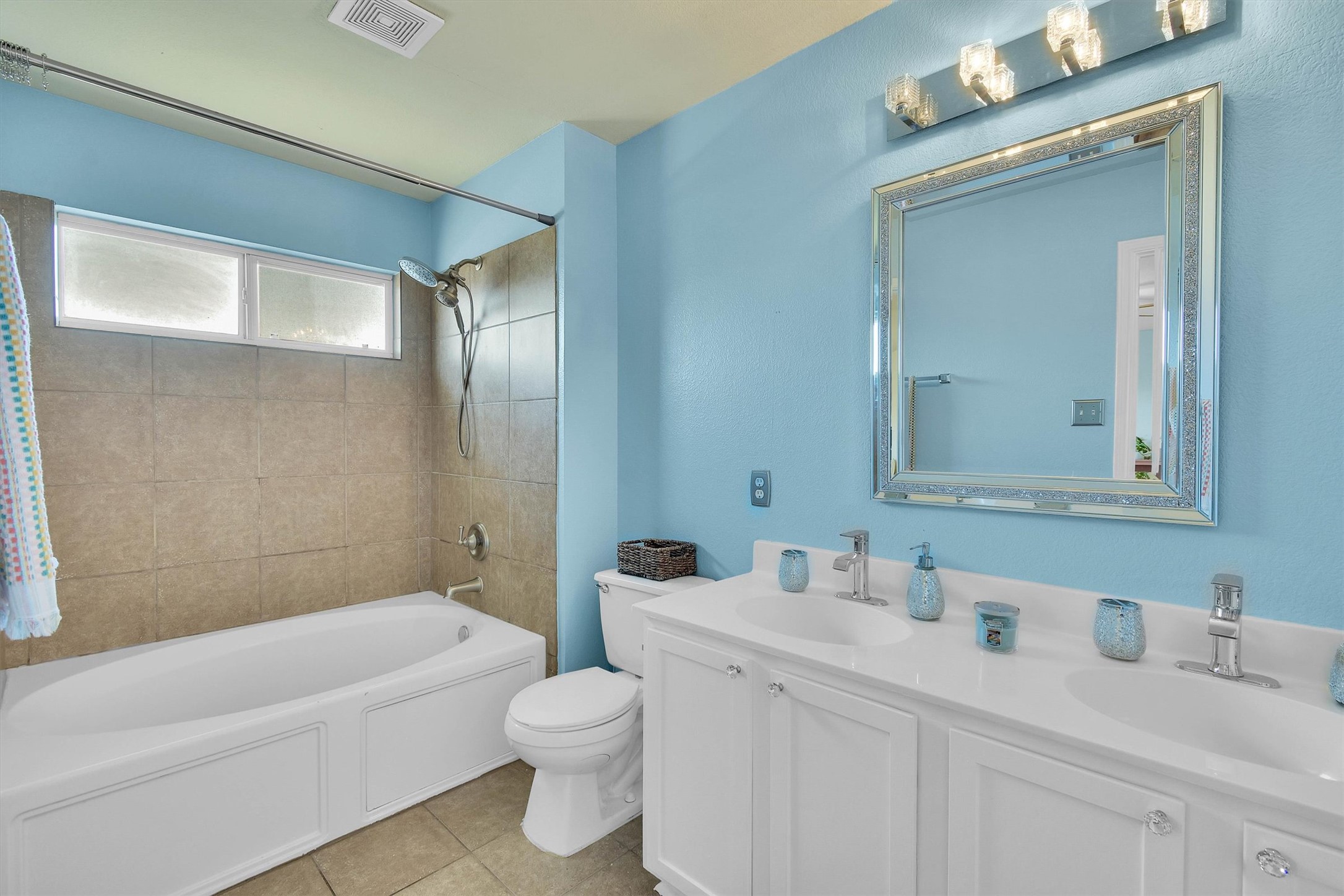 92 Verde Ranch Loop Leander, TX 78641 - Photo 24 of 37 Full bath with double vanity, bathtub / shower combination, and light tile patterned flooring