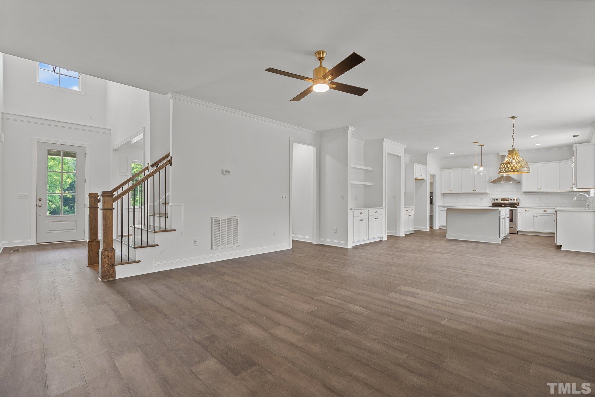 488 Pine Ridge Road Zebulon, NC 27597 - Photo 2 of 47 a view of a livingroom with a ceiling fan and window